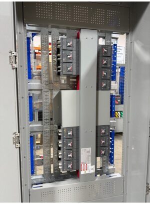 67Panelboard - ABB Plug In type - Coastal Power Systems Industrial electrical control panel with black circuit breakers and vertical busbars inside a metal enclosure
